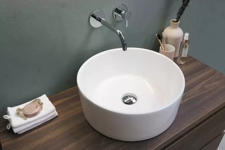 A contemporary-style sink with a stainless steel faucet.